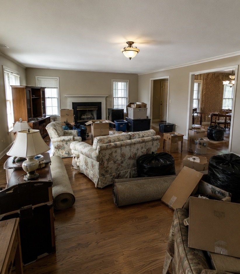 Home interior full of leftover belongings before a property cleanout