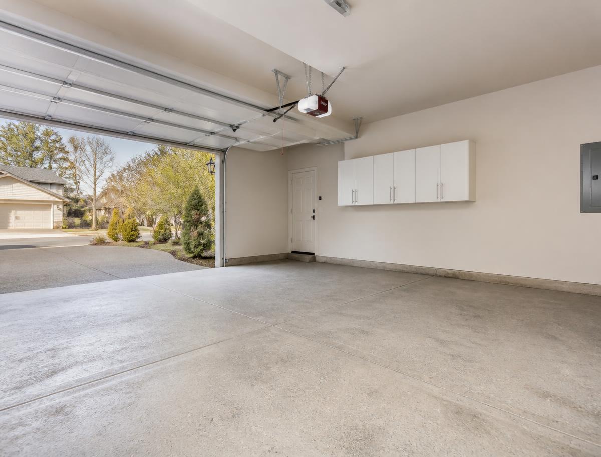 Empty swept suburban garage after a Greater Good junk removal cleanout